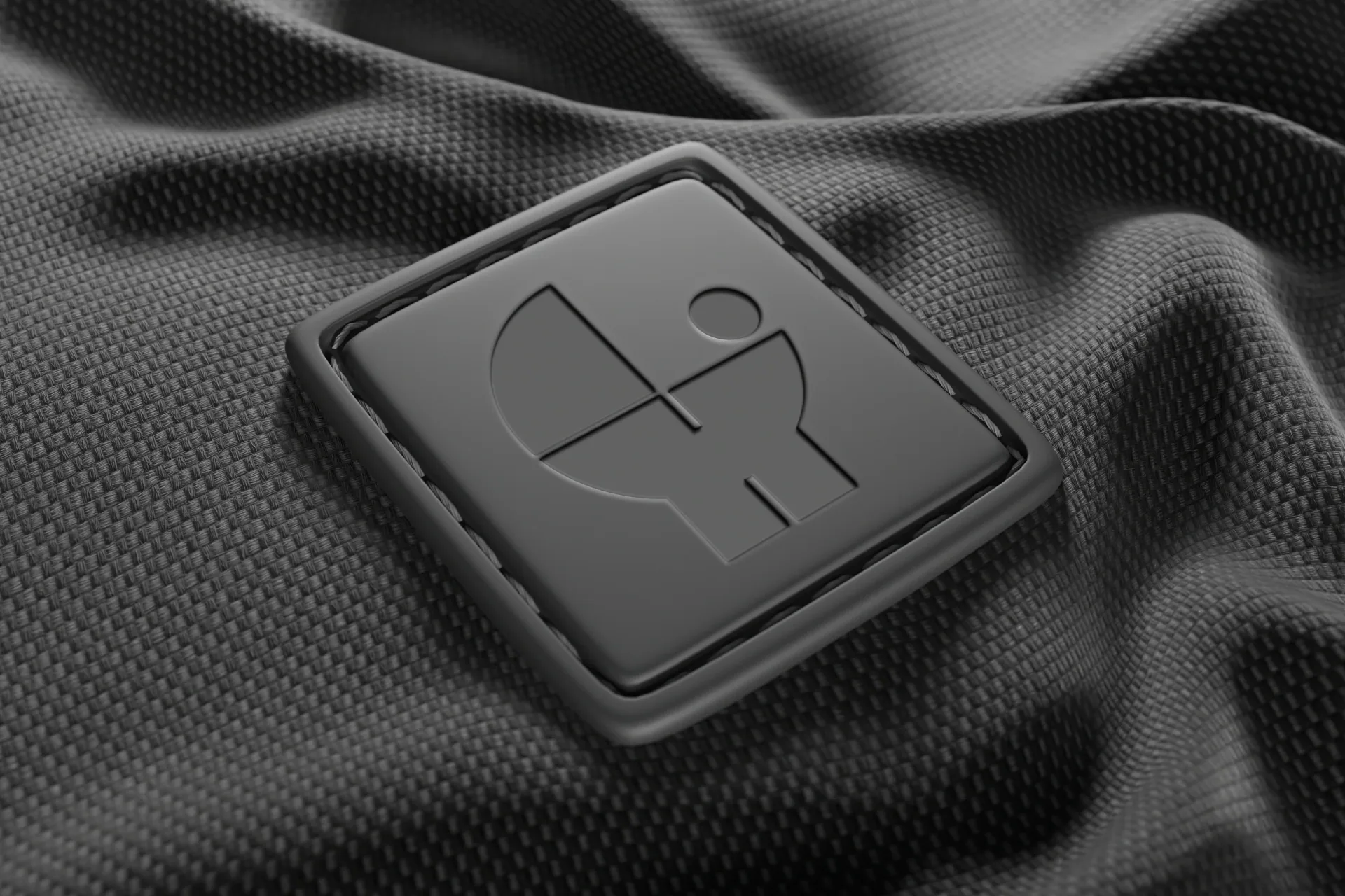 Arca embossed symbol on a black fabric label