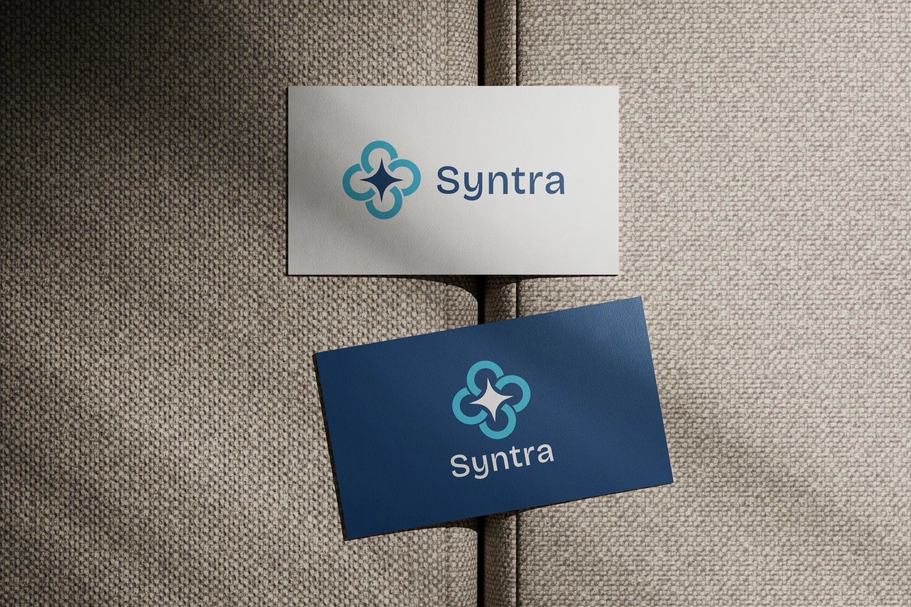 Blue and white Syntra business cards