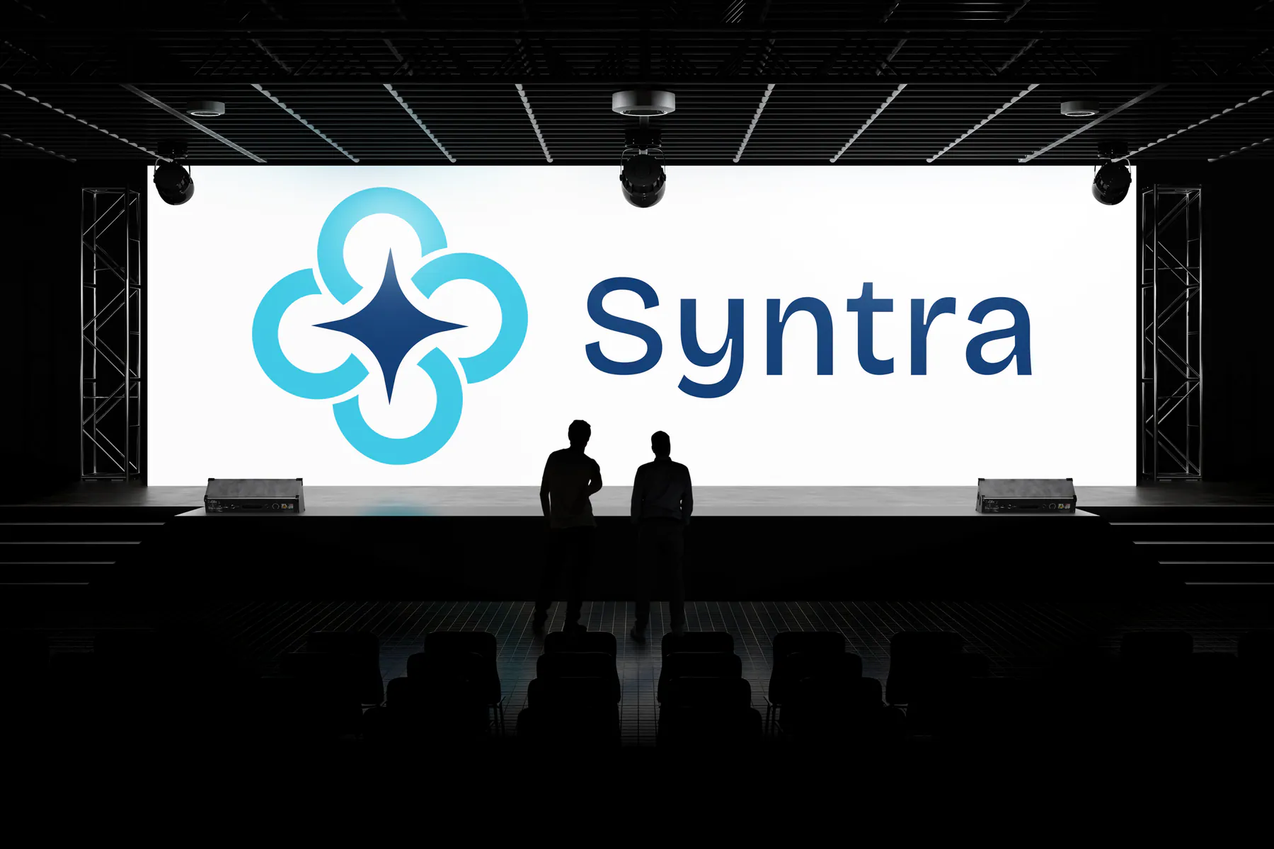Syntra logo displayed on a large event screen