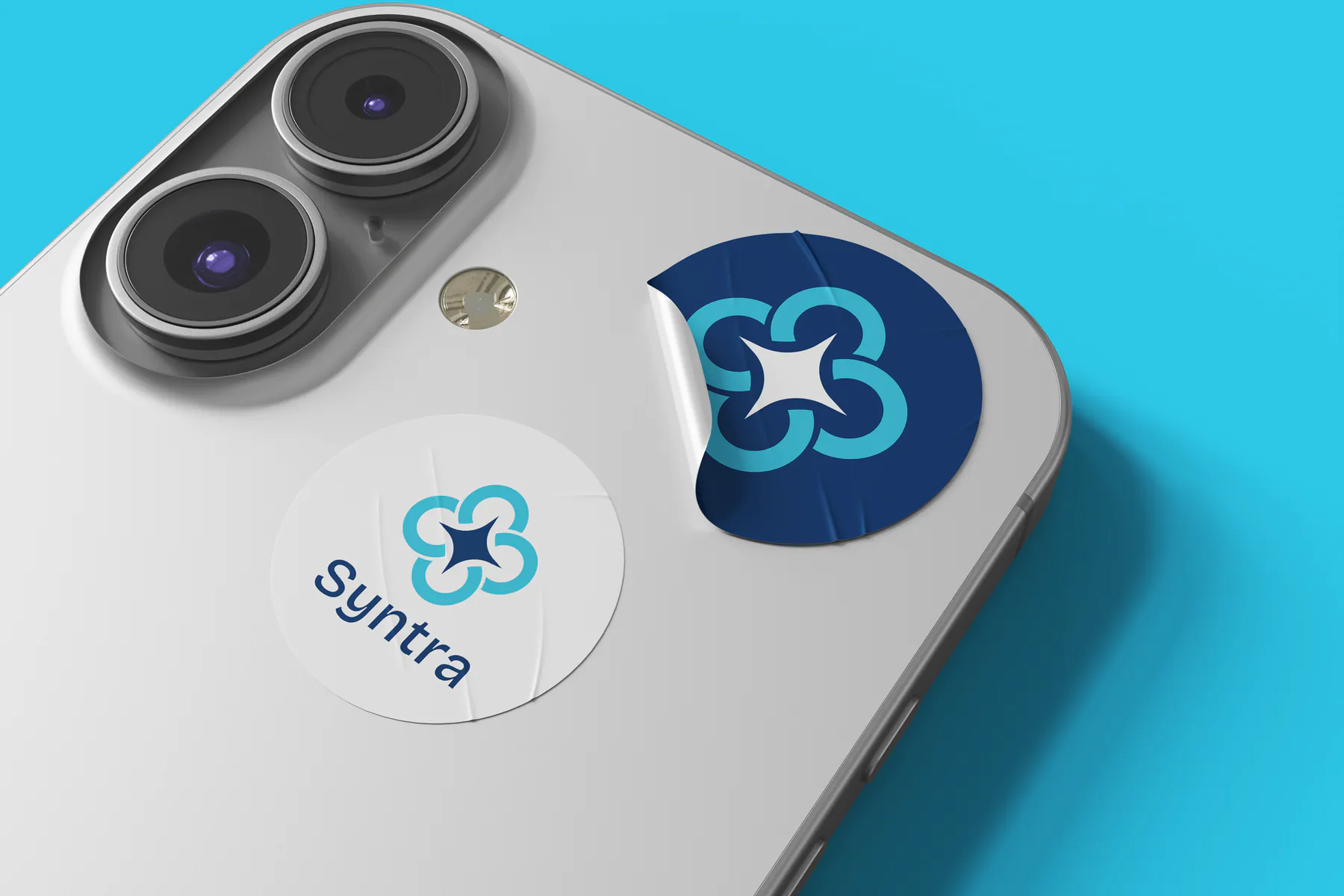 Syntra branded stickers on a phone
